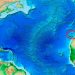 Mega Tsunami das Canárias: impacto que pode superar 1755 Ilustração de um mega tsunami no Atlântico originado nas Canárias, com ondas gigantes aproximando-se da costa portuguesa