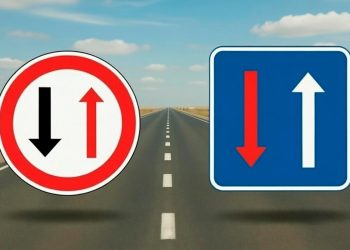 Sinais de trânsito B5 e B6 lado a lado numa via estreita mostrando cedência e prioridade de passagem